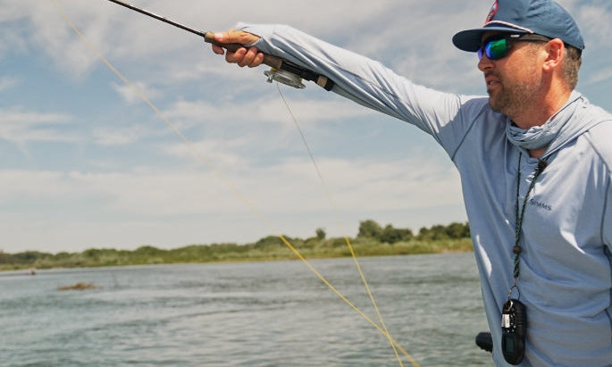 Man casting a fly fishing rod