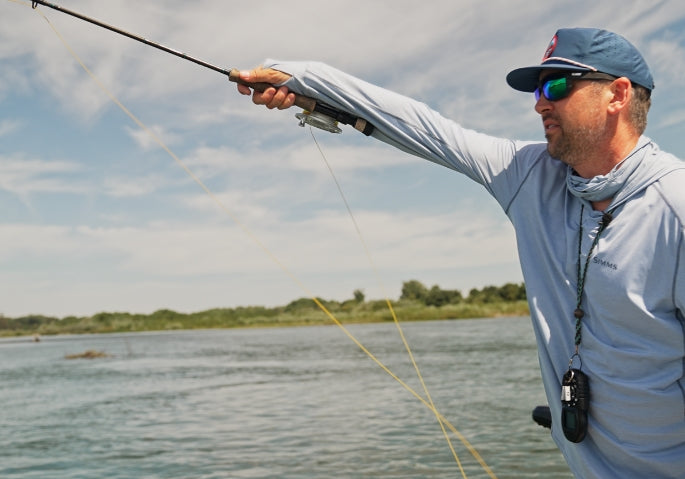 Man casting a fly fishing rod